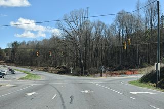 Long Branch Road meanders 6.14 miles south from the ensuing eastbound traffic light to U.S. 29 (Battleground Avenue) near NC 216 and I-85.