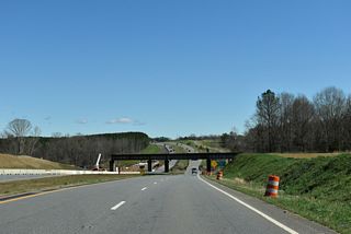 The abandoned Seaboard Coast Line Railroad bridge spanning U.S. 74 (Dixon Boulevard) just ahead of Sandy Run was removed as part of the U.S. 74 Improvements Project (R-4045).