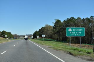 U.S. 74 Business (Shelby Road) follows the former alignment east from the forthcoming parclo interchange.