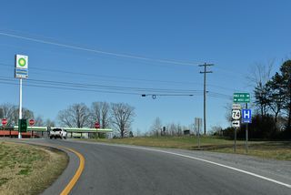 Moss Lake lies north of U.S. 74 and U.S. 74 Business (Shelby Road) via Stony Point Road (SR 1001).