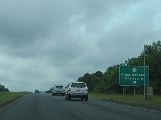 NC 216 heads 5.3 miles south from U.S. 74 along Piedmont Avenue to connect with Battleground Avenue through Downtown Kings Mountain. The state route converges with U.S. 29 beyond its separation with I-85 south at Archdale.