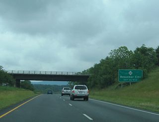 A Norfolk-Southern Railroad line passes over U.S. 74 one half mile west of the diamond interchange with NC 161 (Cleveland Avenue).