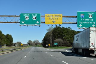 Ramps for I-85/U.S. 29 south to Spartanburg and I-85 north to Charlotte depart in unison from U.S. 74 east. The eastbound roadway for U.S. 74 emerges from an ensuing overpass to run between the north and south roadways for I-85. U.S. 29 combines with the route east along Kings Mountain Highway to Gastonia.