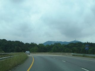 The ramp for I-85 north joins a collector distributor roadway north to U.S. 29/74 (Kings Mountain Highway) east and U.S. 74 west.