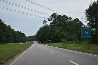 Future I-74 Corridor sign posted ahead of Armstrong Road north to Laurel Hill Industrial Park.