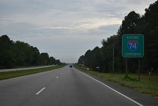 Another Future I-74 corridor sign stands along U.S. 74 west of McEachin Road (SR 1347).