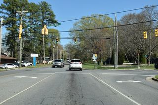 Phifer Road (SR 2256) east meets U.S. 74 Business (King Street) across from Country Club Road to Kings Mountain Country Club golf course.