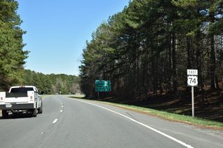 U.S. 74 Business defaults onto U.S. 74 eastbound beyond Canterbury Road.