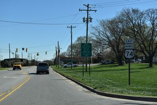 Confirming marker for U.S. 74 Business (Marion Street) east posted after NC 180 (Post Road).