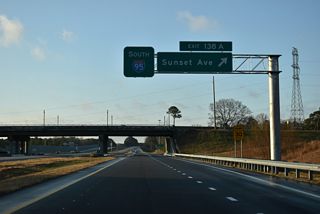 The exchange with Sunset Avenue (SR 1770) at Exit 138 A fully opened to traffic in the second week of December 2025. Sunset Avenue is part of the pre-freeway alignment of U.S. 64 west to Nashville.