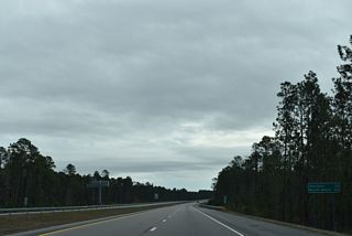 The southernmost section of I-140 opened to traffic on October 16, 2014 and was posted as NC 140 until 2017. The distance to Shallotte decreased from 34 to 32 miles from the previous distance sign, yet Myrtle Beach remains 64 miles away.