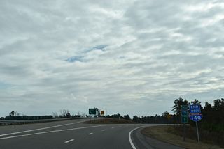 An end shield for Interstate 140 stands at the trumpet interchange (Exit 1) with U.S. 17.