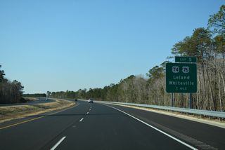 U.S. 74/76 branch northwest from US. 17 at the town of Belville along a freeway to Lanvale Road and Leland. The US highways transition into an at-grade arterial west to meet I-140 at Exit 5.