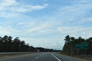 A parclo interchange (Exit 8) follows with Mt. Misery Road (SR 1426) in one mile.
