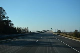 Until December 19, 2017, I-140 ended at U.S. 421 and the west end of the Dan Cameron Bridge.