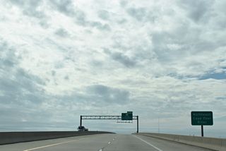 The apex of the Dan Cameron Bridge across the NE Cape Fear River tops out at 65 feet. The high-level span measures 7,402.3 feet in length.2