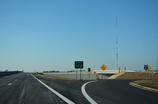 A previous end shield for Interstate 140 appeared along the loop ramp to U.S. 421.