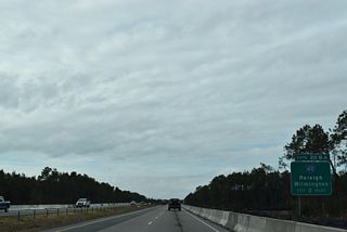 NC 140 plies across timberland north of Murrayville two miles to a directional cloverleaf interchange (Exit 20) with I-40.