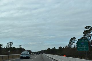 I- 40 travels 420 miles across North Carolina, joining Wilmington with Raleigh, Durham, the Piedmont Triad and Asheville. The freeway splits with U.S. 117 at Murraysville and parallels the highway northward to Burgaw, Wallace and Warsaw.