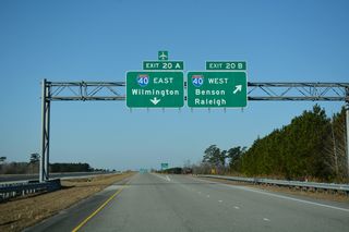 Interstate 40 ventures 92 miles north from Exit 20B to meet I-95 near Benson. Raleigh is 25 miles further.