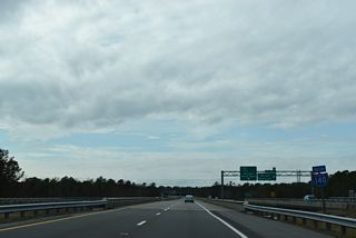 The initial section of I-140 was designated from the exchange with I-40 west to U.S. 421 across the NE Cape Fear River.