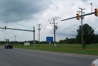 NC 168 (Caratoke Highway) reaches the Virginia state line at North Point Boulevard by the Border Station store (the store is bisected by the state boundary). Virginia 168 begins here and travels a short distance onto the tolled Chesapeake Expressway