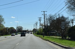 NC 180 (Post Road) south meets U.S. 74 Business (Marion Street) by the Cleveland County Fairgrounds and Cleveland Community College.
