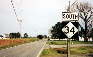 NC 344 (former NC 34) leaves the city of Elizabeth City and the U.S. Coast Guard Station area and transitions into a rural two lane roadway. The final shield for NC 34 south stood beyond the turn from Salem Church Road onto Soundneck Road.