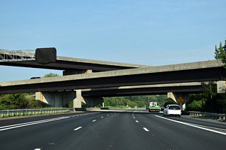 Six overall lanes are maintained along Interstate 485 through the four level interchange with I-77/U.S. 21.