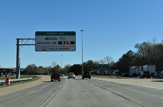 Toll schedule sign for the I-485 Express Lanes east to U.S. 521 (Johnston Road).