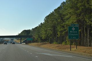 I-587/795-U.S. 264 continue south from I-95 to a folded diamond interchange (Exit 20) with NC 42.