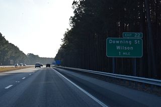 A folded diamond interchange (Exit 22) joins I-587/795-U.S. 264 with Downing Road (SR 1163) southeast of Contentnea Creek.