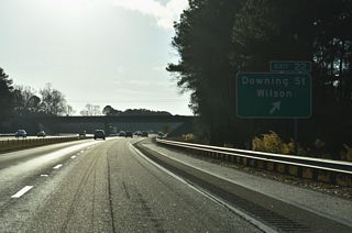 Downing Street crosses Wiggins Mill Reservoir northeast from Exit 22 to Goldsboro Street within the Wilson street grid.