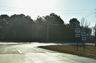 Following the designation of I-795, U.S. 117 was returned to its previous alignment, which ends at U.S. 301 just south of Exit 24 A.