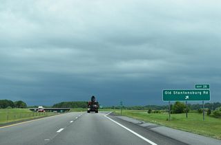3.17 miles to the north, SR 1602 stems east from Black Creek Road along Stantonsburg Road, which becomes Old Stantonsburg Road south to a folded diamond interchange (Exit 28) with I-587/U.S. 264.