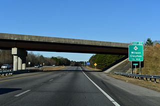 NC 42 runs 26.6 miles west from Exit 20 to U.S. 70/NC 36 at Clayton. Beyond the route gap west to NC 50, NC 42 resumes to Fuquay-Varina and Sanford.