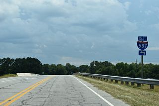 Meeting Interstate 587 at Exit 53, Mozingo Road (SR 1210) forms a 1.70 mile long loop north from Stantonsburg Road SR 1200) to Voa Site C Road (SR 1212) in a rural area of Pitts County west of Greenville.