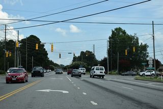 Stantonsburg Road (SR 1467) continues 0.46 miles east from B's Barbeque Road to the signalized intersection with Allen Road (SR 1203).