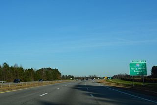 I-795/587-U.S. 264 advance one mile north to a cloverleaf interchange (Exit 18) with Interstate 95.