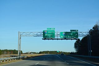Exit 18 B departs I-795/587-U.S. 264 for Interstate 95, 136 miles north to Richmond, Virginia.