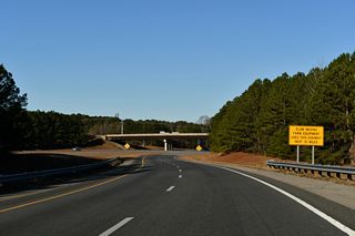 Until June 2022, Interstate 587 remained a future route along U.S. 264 partly due to slow moving farm equipment permitted along the freeway.