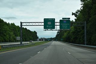 Interstate 795 overtakes the freeway formerly leading U.S. 117 south to Goldsboro. Exit 5 nearby joins I-795 with U.S. 301 leading southwest to Kenly, while I-587/U.S. 264 meet the route directly at Exits 24 A/B.