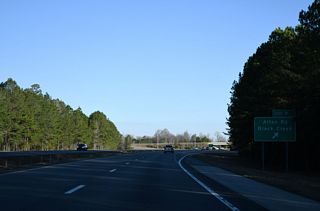 Alton Road joins I-795 with U.S. 117 near the town of Black Creek. Alton Road continues 1.60 miles west from Exit 9 to Little Rock Church Road (SR 1649) south of Lucama.