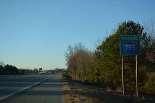 Removed by 2021, a Future I-795 sign was added along NC 581 CTR in late 2017. NC 581 leads direct onto U.S. 13/117, which parallel just to the east.