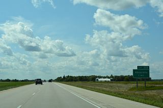 Exit 322 links I-94/U.S. 52 west with 147th Avenue SE in one mile.