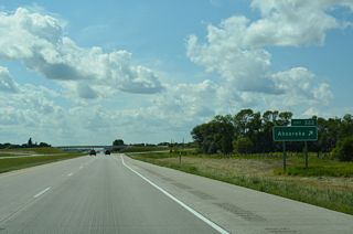 The unincorporated community of Absaraka lies 8.6 miles to the north of Exit 322 via 147th Avenue SE and connecting roads.