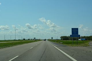 The truck parking area follows the Maple River at mile marker 337.