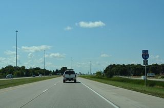 Beaton Drive parallels the north side of I-94 from 9th Street E to Sheyenne Street by this set of shields.