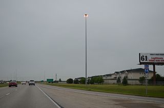 The first U.S. 52 confirming marker posted since the US highway joined Interstate 94 in St. Paul, Minnesota appears by the 45th Street entrance ramp.