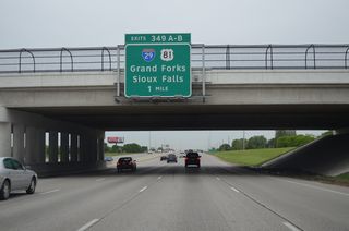 I-94/U.S. 52 advance one mile west from 25th Street S to Exits 349 A/B for I-29/U.S. 81. I-29/U.S. 81 pass through Fargo between Frontier and Reiles Acres.